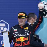 
              Red Bull driver Max Verstappen of the Netherlands, winner of the Formula One Miami Grand Prix auto race, holds his trophy and a Miami Dolphins' helmet at the Miami International Autodrome, Sunday, May 8, 2022, in Miami Gardens, Fla. (AP Photo/Lynne Sladky)
            