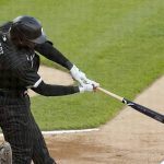 
              Chicago White Sox's Luis Robert singles off Cleveland Guardians starting pitcher Zach Plesac during the first inning of a baseball game Monday, May 9, 2022, in Chicago. (AP Photo/Charles Rex Arbogast)
            