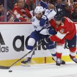 
              Florida Panthers defenseman Ben Chiarot (8) and Tampa Bay Lightning left wing Brandon Hagel (38) vie for the puck during the first period of Game 2 of an NHL hockey second-round playoff series Thursday, May 19, 2022, in Sunrise, Fla. (AP Photo/Reinhold Matay)
            