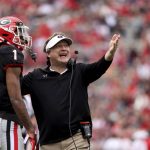 
              Georgia coach Kirby Smart talks with defensive back Nyland Green (1) after a play during the NCAA college football team's G-Day game Saturday, April 16, 2022, in Athens, Ga. (Jason Getz/Atlanta Journal-Constitution via AP)
            