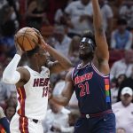 
              Miami Heat center Bam Adebayo (13) looks for an opening past Philadelphia 76ers center Joel Embiid (21) during the first half of Game 5 of an NBA basketball second-round playoff series, Tuesday, May 10, 2022, in Miami. (AP Photo/Wilfredo Lee)
            