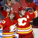 
              Calgary Flames forward Matthew Tkachuk, right, celebrates his goal against the Edmonton Oilers with forward Johnny Gaudreau during the third period of Game 1 of an NHL hockey second-round playoff series Wednesday, May 18, 2022, in Calgary, Alberta. (Jeff McIntosh/The Canadian Press via AP)
            