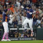 
              Houston Astros' Alex Bregman, right, celebrates with third base coach Gary Pettis after hitting a home run against the Detroit Tigers during the fifth inning of a baseball game Sunday, May 8, 2022, in Houston. (AP Photo/David J. Phillip)
            