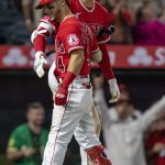 
              Los Angeles Angels' Andrew Velazquez, left, gets congratulations from Shohei Ohtani after Velazquez hit a two-run home run against the Oakland Athletics during the seventh inning of a baseball game in Anaheim, Calif., Saturday, May 21, 2022. (AP Photo/Alex Gallardo)
            