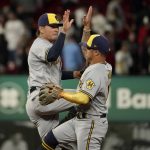 
              Milwaukee Brewers' Luis Urias, left, and Kolten Wong celebrate a 4-3 victory over the St. Louis Cardinals following a baseball game Thursday, May 26, 2022, in St. Louis. (AP Photo/Jeff Roberson)
            