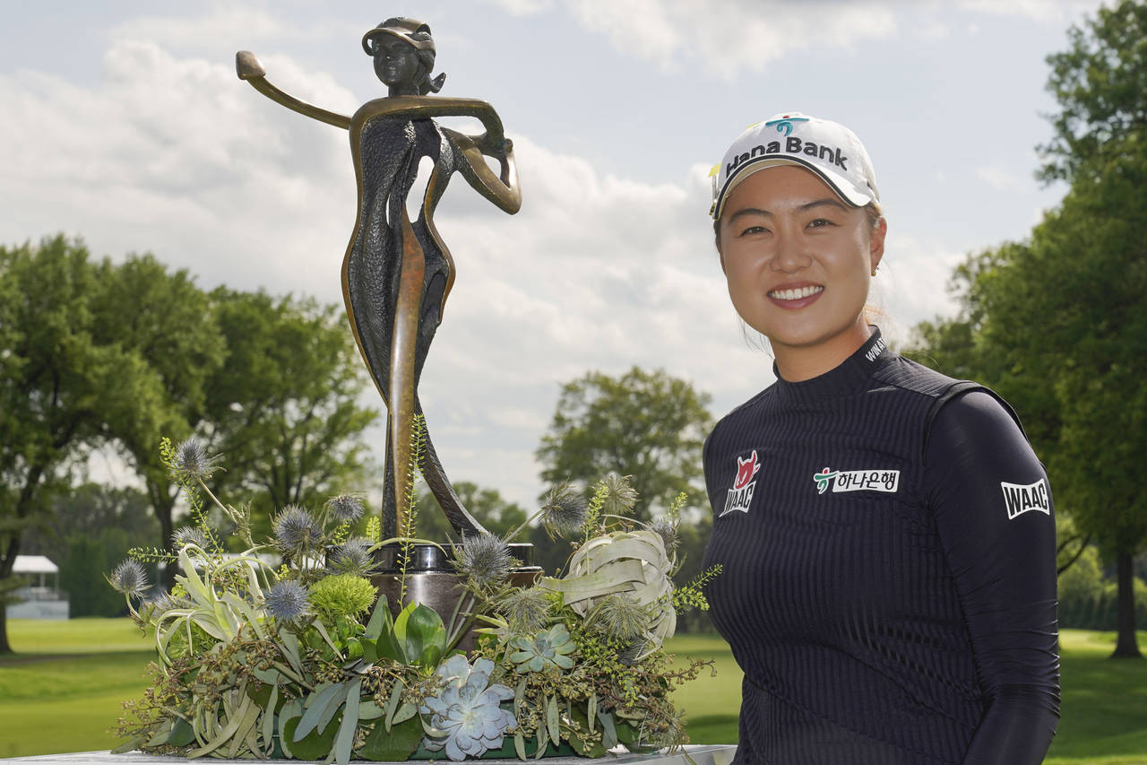 Minjee Lee, of Australia, poses with the trophy after winning the LPGA Cognizant Founders Cup golf ...