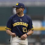 
              Michigan head coach Erik Bakich returns to the dugout after arguing with the umpires following a play at first base against Rutgers in the first inning of the NCAA college Big Ten baseball championship game Sunday, May 29, 2022, at Charles Schwalb Field in Omaha, Neb. (AP Photo/Rebecca S. Gratz)
            