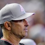 
              Arizona Diamondbacks manager Torey Lovullo watches the action on the field in the first inning of a baseball game against the Colorado Rockies, Sunday, May 8, 2022, in Phoenix. (AP Photo/Ross D. Franklin)
            