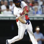 
              Cleveland Guardians' Amed Rosario hits an RBI single against the Detroit Tigers during the sixth inning of a baseball game, Friday, May 20, 2022, in Cleveland. (AP Photo/Ron Schwane)
            