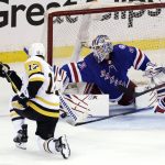 
              New York Rangers goaltender Igor Shesterkin makes a save on a shot by Pittsburgh Penguins right wing Bryan Rust (17) during the third period of Game 1 of an NHL hockey Stanley Cup first-round playoff series Tuesday, May 3, 2022, in New York. (AP Photo/Adam Hunger)
            