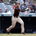 
              San Diego Padres' Austin Nola hits an RBI double against the Cleveland Guardians during the sixth inning in the first baseball game of a doubleheader, Wednesday, May 4, 2022, in Cleveland. (AP Photo/Ron Schwane)
            