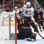 
              Los Angeles Kings' Phillip Danault (24) scores a goal on Edmonton Oilers goalie Mike Smith (41) during the third period of Game 1 of an NHL hockey Stanley Cup first-round playoff series, Monday, May 2, 2022 in Edmonton, Alberta. (Jason Franson/The Canadian Press via AP)
            