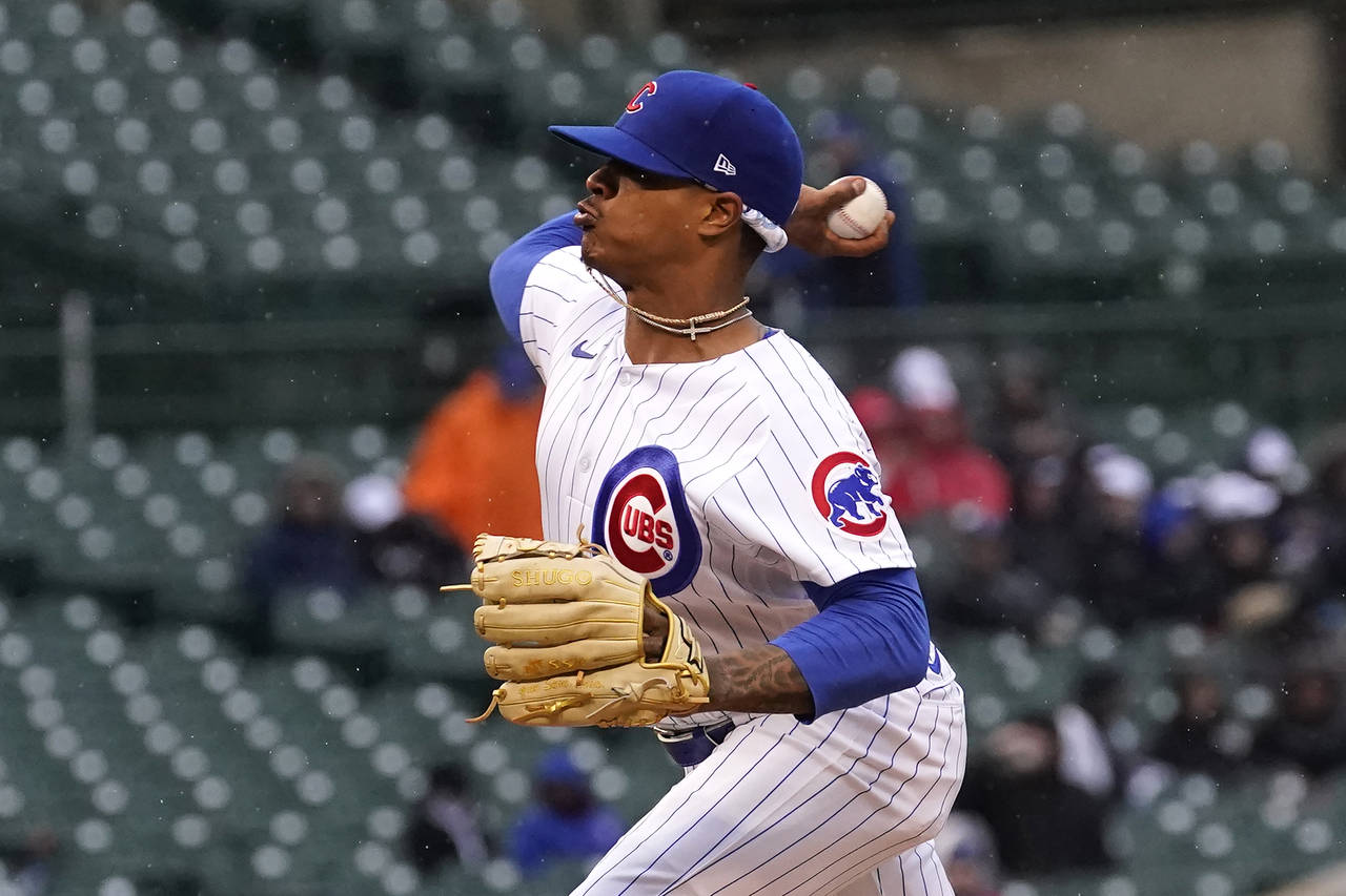 Chicago Cubs starting pitcher Marcus Stroman delivers during the first inning of a baseball game ag...