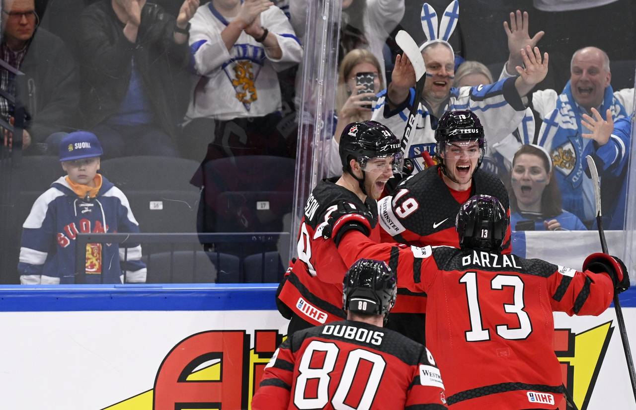 Team of Canada celebrates a overtime goal scored by Drake Batherson, during the Hockey World Champi...