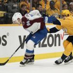 
              Colorado Avalanche right wing Mikko Rantanen (96) and Nashville Predators' Roman Josi (59) battle for the puck during the first period in Game 4 of an NHL hockey first-round playoff series Monday, May 9, 2022, in Nashville, Tenn. (AP Photo/Mark Humphrey)
            