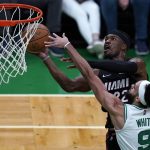 
              Boston Celtics guard Derrick White (9) pressures Miami Heat forward Jimmy Butler (22) on a shot during the first half of Game 4 of the NBA basketball playoffs Eastern Conference finals, Monday, May 23, 2022, in Boston. (AP Photo/Charles Krupa)
            
