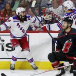 
              New York Rangers' Mika Zibanejad, left, congratulates Chris Kreider (20) on his goal behind Carolina Hurricanes' Brett Pesce (22) during the first period of Game 7 of an NHL hockey Stanley Cup second-round playoff series in Raleigh, N.C., Monday, May 30, 2022. (AP Photo/Karl B DeBlaker)
            