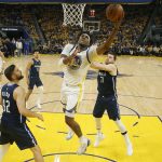 
              Golden State Warriors center Kevon Looney (5) shoots against the Dallas Mavericks during the first half of Game 2 of the NBA basketball playoffs Western Conference finals in San Francisco, Friday, May 20, 2022. (AP Photo/Jed Jacobsohn)
            