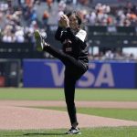 
              Former Olympic figure skater Kristi Yamaguchi throws out the ceremonial first pitch before a baseball game between the San Francisco Giants and the San Diego Padres in San Francisco, Saturday, May 21, 2022. (AP Photo/Jeff Chiu)
            