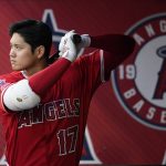 
              Los Angeles Angels designated hitter Shohei Ohtani (17) warms up in the dugout during the first inning of a baseball game against the Toronto Blue Jays in Anaheim, Calif., Saturday, May 28, 2022. (AP Photo/Ashley Landis)
            