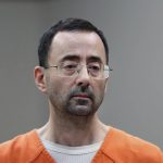 
              FILE - Dr. Larry Nassar, appears in court for a plea hearing on Nov. 22, 2017, in Lansing, Mich. The U.S. Justice Department said Thursday, May 26, 2022 it will not pursue criminal charges against former FBI agents who failed to quickly open an investigation of sports doctor Larry Nassar despite learning in 2015 that he was accused of sexually assaulting female gymnasts.(. (AP Photo/Paul Sancya File)
            