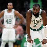
              Boston Celtics' Jaylen Brown (7) watches a Miami Heat player shoot a free throw during the second half of Game 3 of the NBA basketball playoffs Eastern Conference finals Saturday, May 21, 2022, in Boston. The Heat won 109-103. (AP Photo/Michael Dwyer)
            