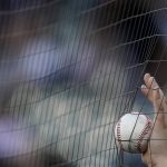 
              A fan holds a ball while waiting for autographs from players before a baseball game between the New York Yankees and the Chicago White Sox in Chicago, Friday, May 13, 2022. (AP Photo/Nam Y. Huh)
            