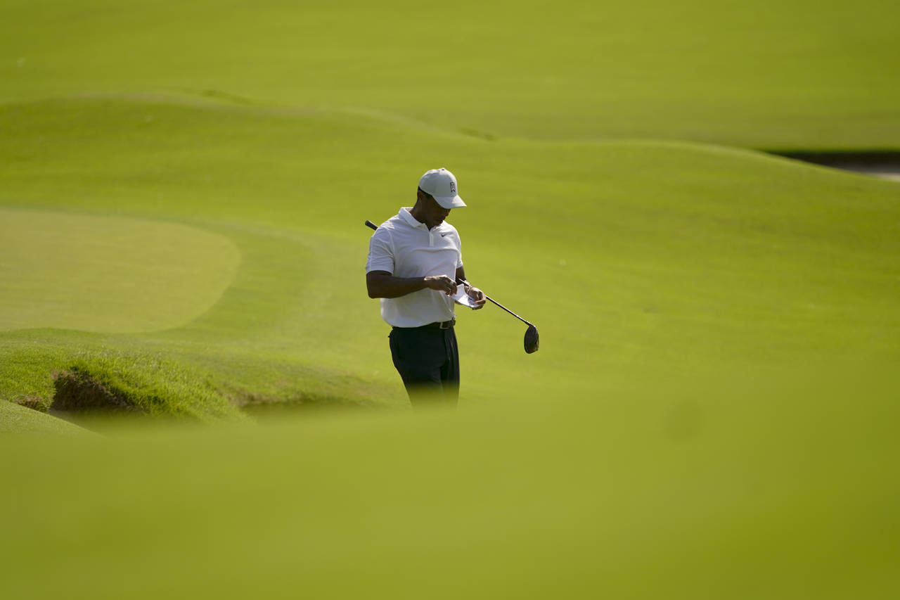 Tiger Woods plays the second hole during a practice round for the PGA Championship golf tournament,...