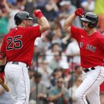 
              Boston Red Sox's Bobby Dalbec celebrates his solo home run with Kevin Plawecki (25) during the sixth inning of the first game of a baseball doubleheader against the Baltimore Orioles, Saturday, May 28, 2022, in Boston. (AP Photo/Michael Dwyer)
            