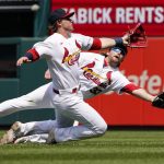 
              St. Louis Cardinals second baseman Nolan Gorman, front, and right fielder Brendan Donovan (33) are unable to catch a foul ball by Milwaukee Brewers' Lorenzo Cain during the sixth inning of a baseball game Sunday, May 29, 2022, in St. Louis. (AP Photo/Jeff Roberson)
            