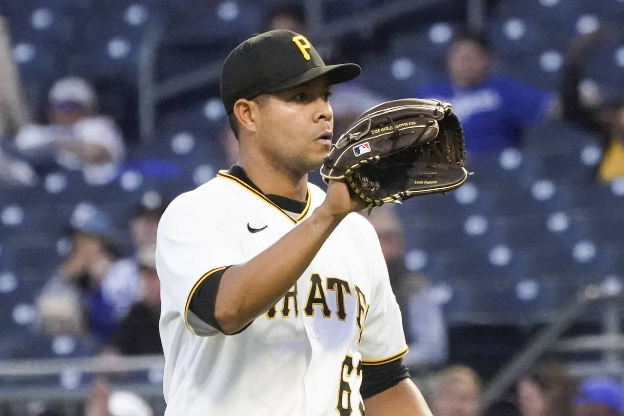 Pittsburgh Pirates starting pitcher Jose Quintana gets a new ball as he pitches against the Los Ang...