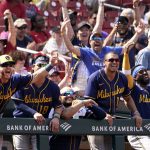
              Members of the Milwaukee Brewers celebrate as teammate Lorenzo Cain rounds the bases after hitting a two-run home run during the eighth inning of a baseball game against the St. Louis Cardinals Sunday, May 29, 2022, in St. Louis. (AP Photo/Jeff Roberson)
            