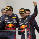 
              Red Bull driver Max Verstappen, left, of the Netherlands, winner of the Emilia Romagna Formula One Grand Prix, celebrates on the podium with second placed Red Bull driver Sergio Perez, of Mexico, at the Enzo and Dino Ferrari racetrack, in Imola, Italy, Sunday, April 24, 2022. (AP Photo/Luca Bruno)
            