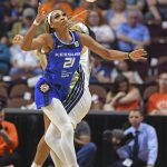 
              Connecticut Sun forward DiJonai Carrington (21) steals the ball from Dallas Wings guard Allisha Gray during a WNBA basketball game Tuesday, May 24, 2022, in Uncasville, Conn. (Sean D. Elliot/The Day via AP)
            