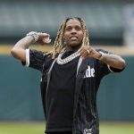 
              Chicago rapper Lil Durk throws out a ceremonial first pitch before a baseball game between the Chicago White Sox and the Los Angeles Angels, Monday, May 2, 2022, in Chicago. (AP Photo/Charles Rex Arbogast)
            