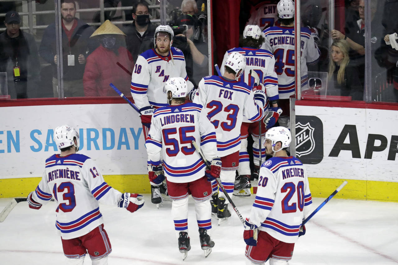 The New York Rangers skate off the ice after losing 3-1 to the Carolina Hurricanes in Game 5 of an ...