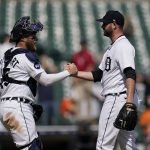 
              Detroit Tigers catcher Tucker Barnhart, left, and pitcher Drew Hutchison celebrate after the final out in the ninth inning of a baseball game against the Oakland Athleticsin Detroit, Tuesday, May 10, 2022. (AP Photo/Paul Sancya)
            