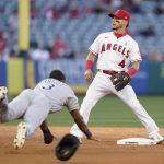 
              Tampa Bay Rays' Manuel Margot (13) steals second base while Los Angeles Angels shortstop Andrew Velazquez (4) waits for a throw during the second inning of a baseball game in Anaheim, Calif., Monday, May 9, 2022. (AP Photo/Ashley Landis)
            