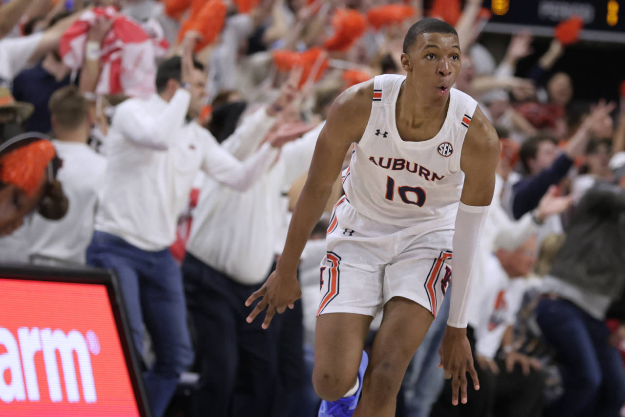FILE - Auburn forward Jabari Smith (10) reacts after making a 3-pointer against Alabama during the ...