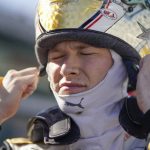 
              Josef Newgarden puts on his helmet during practice for the Indianapolis 500 auto race at Indianapolis Motor Speedway, Tuesday, May 17, 2022, in Indianapolis. (AP Photo/Darron Cummings)
            