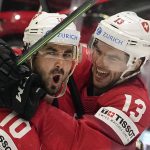
              Switzerland's Andres Ambuhl, left, celebrates with teammate Nico Hischier, right, after he scored his side's third goal during the group A Hockey World Championship match between Switzerland and France in Helsinki, Finland, Sunday May 22 2022. (AP Photo/Martin Meissner)
            
