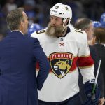 
              Florida Panthers center Joe Thornton (19) ongratulates Tampa Bay Lightning head coach Jon Cooper after the Lightning eliminated the Panthers during Game 4 of an NHL hockey second-round playoff series Monday, May 23, 2022, in Tampa, Fla. (AP Photo/Chris O'Meara)
            