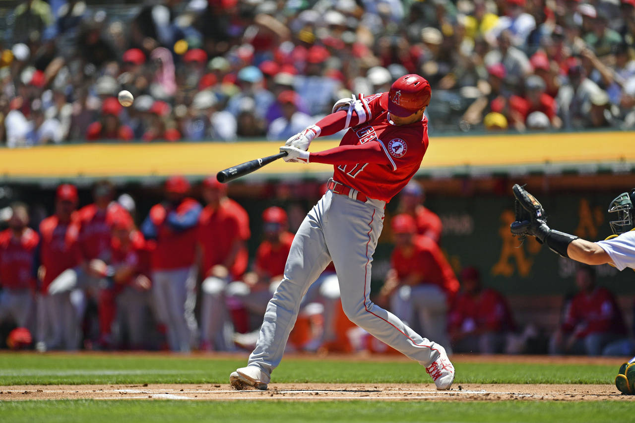 Los Angeles Angels' Shohei Ohtani (17) connects for a two-run home run against Oakland Athletics pi...