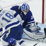 
              Toronto Maple Leafs goaltender Jack Campbell (36) makes a glove save against Tampa Bay Lightning forward Ondrej Palat (18) during the first period of Game 2 of an NHL hockey Stanley Cup playoffs first-round series Wednesday, May 4, 2022, in Toronto. (Nathan Denette/The Canadian Press via AP)
            
