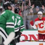 
              Calgary Flames center Mikael Backlund, right, reacts after scoring a goal against the Dallas Stars during the second period of Game 6 of an NHL hockey Stanley Cup first-round playoff series, Friday, May 13, 2022, in Dallas. (AP Photo/Tony Gutierrez)
            