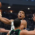 
              Milwaukee Bucks' Giannis Antetokounmpo looks to pass around Boston Celtics' Grant Williams during the first half of Game 4 of an NBA basketball Eastern Conference semifinals playoff series Monday, May 9, 2022, in Milwaukee. (AP Photo/Morry Gash)
            