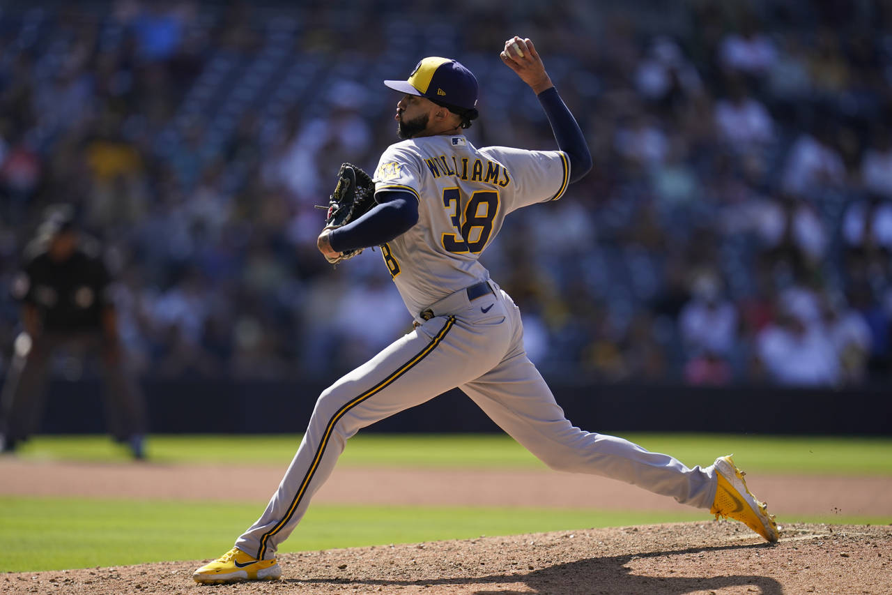 Milwaukee Brewers relief pitcher Devin Williams works against a San Diego Padres batter during the ...