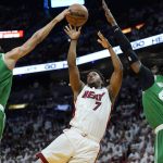 
              Boston Celtics guard Derrick White (9) and center Robert Williams III (44) block a shot to the basket by Miami Heat guard Kyle Lowry (7) during the first half of Game 7 of the NBA basketball Eastern Conference finals playoff series, Sunday, May 29, 2022, in Miami. (AP Photo/Lynne Sladky)
            