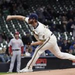 
              Milwaukee Brewers starting pitcher Brandon Woodruff throws during the first inning of a baseball game against the Cincinnati Reds Tuesday, May 3, 2022, in Milwaukee. (AP Photo/Morry Gash)
            