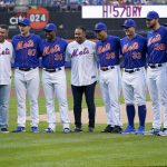 
              Former New York Mets pitcher Johan Santana, fourth from left, and former catcher Josh Thole, left, pose for photographers with current Mets players during a celebration of the 10th anniversary of the first no-hitter in Mets' history, before the team's baseball game against the Washington Nationals, Tuesday, May 31, 2022, in New York. (AP Photo/Mary Altaffer)
            